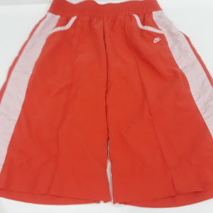 Nike orange and white athletic cropped pants